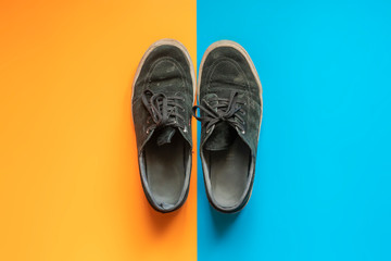 top view of pair canva sneaker shoes isolated on double color surface f