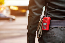 Security Guard Uses Radio Communication For Facilitate Traffic. Traffic Officers Use Radio Communication To Maintain Order In The Parking Lot In Thailand.