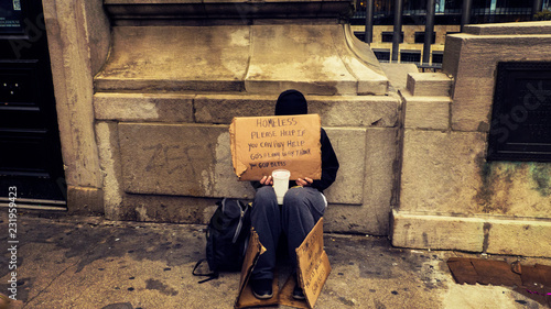 Cuadros en Lienzo Homeless Person Begging On A Dirty Urban Street in Large City