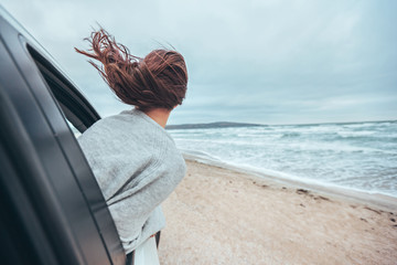 Car trip by cold sea in winter