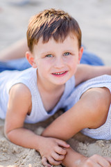 Wall Mural - Portrait of a boy in the summer outdoors