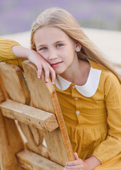 portrait of little girl outdoors in summer