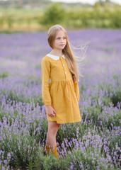 portrait of little girl outdoors in summer