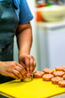 © Reinholds - Female Chef Making Round Pork Cutlet for Some Burgers for  Wedding Meal