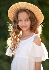 portrait of little girl outdoors in summer