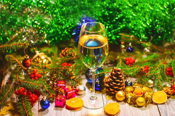 a glass of champagne or white wine on a new year background, Christmas decorations