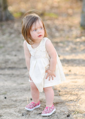 portrait of little girl outdoors in summer