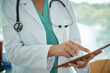 © Gregory Miller - Doctor touching a tablet