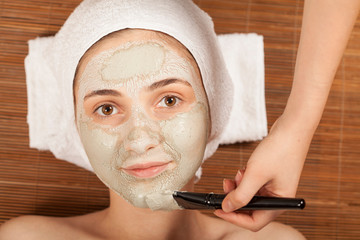 beautiful woman have a skin care mask