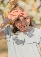 portrait of little girl outdoors in summer