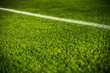 © Aleksander - Green bright colorful grass pitch of football stafium, close up with beautiful bokeh and stripes