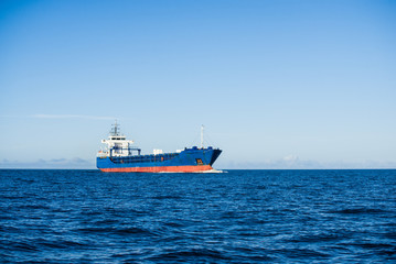 Wall Mural - Large cargo ship in the Baltic sea on a sunny day, Latvia