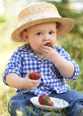 portrait of a little boy in nature