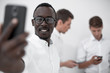 © ASDF - close up.young businessman taking a selfie.