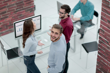 Canvas Print - Creative business people listening to young man explanations.