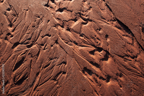 Fotografie, Obraz textured pattern in red dirt water trails