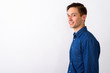 © Ranta Images - Studio shot of happy young handsome man smiling against white ba