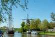 A Classic Dutch Windmill in the city of Dokkum, Friesland, in the Northern parts of the Netherlands, as seen on a bright sunny spring afternoon