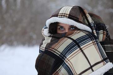 Beautiful girl in a beautiful winter park