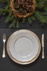 Wall Mural - Christmas table setting with silverware and dark evergreen decor. Top view. Holiday Centerpieces.