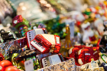 Wall Mural - Accordion christmas ornament on the advent market stall, close up