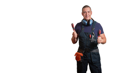 Strong male mechanic in blue overal standing on a white isolated background