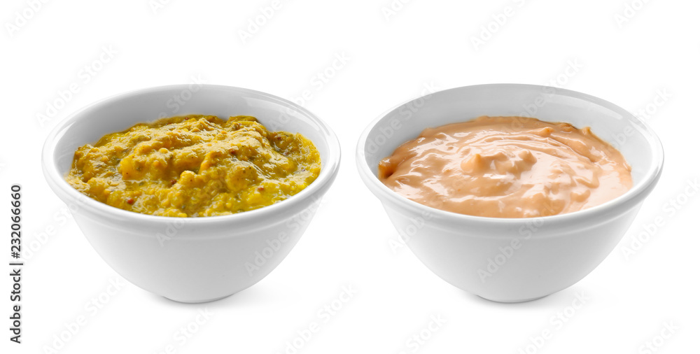 Tasty sauces in bowls on white background