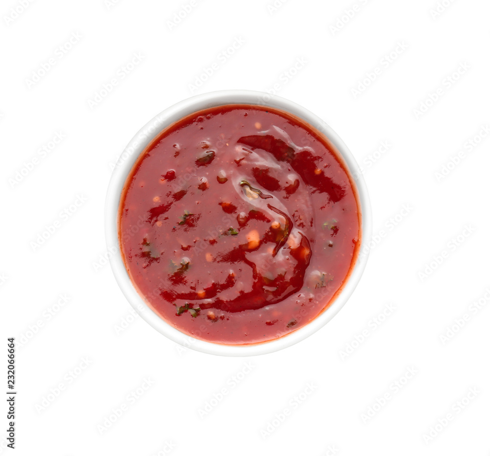 Tasty tomato sauce in bowl on white background