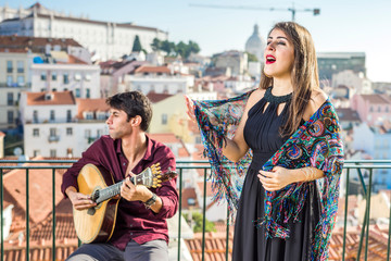 Beautiful fado singer performing with handsome portuguese guitarist player, Portugal