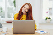 © contrastwerkstatt - Young happy red-haired woman using laptop