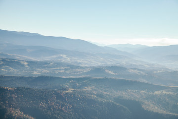 hazy mountains landscape under blue sky, Carpathians, Ukraine