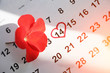 © Stanislaw Mikulski - Red flower lay on the calendar with the date of February 14 Valentine's day