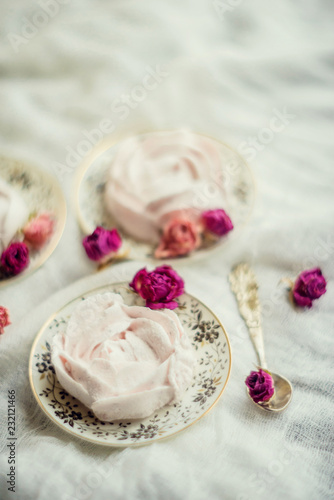 Fotografie, Obraz Homemade marshmallow with fresh raspberries on a textile background with a Cup of coffee