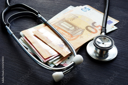 Stethoscope And Euro Banknotes On A Desk Health Insurance And