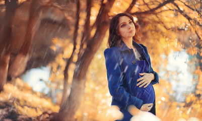 Pregnant woman on a walk in the park