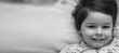 © alexkich - Black and white photo portrait of a young child lying on a pillow