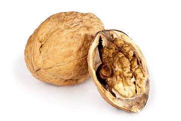 Two walnuts on a white background