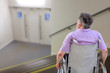© JPC-PROD - concept of the inadaptability of places for disabled: senior man in a wheelchair at the top of steps