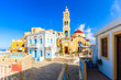Colorful houses and church square in Olympos mountain village, Karpathos island, Greece