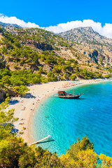 Wall Mural - Sailing boat anchoring at beautiful Apella beach on Karpathos island, Greece