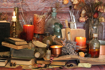 Wall Mural - Antique Magic Book. Witchcraft Peacock feathers and candle background. Black candle Magic Ritual.