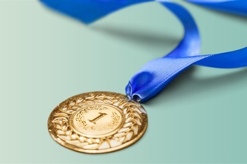 Gold medal with  ribbon  on  background