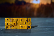 Reflect - Rethink - Revise On Wooden Blocks. Cross Processed Image With Bokeh Background