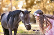 © fotoskaz - Cute little girl and pony in a beautiful park