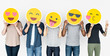 Leinwandbild Motiv Diverse people holding happy emoticons
