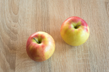 Wall Mural - Ripe apples on a wooden background