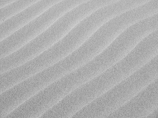 Wall Mural - gray sand wave ripple at the beach