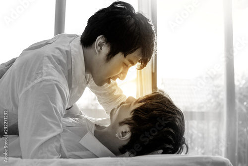 Asian Gay Couple Kissing Homosexual Couple On Bed In