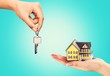 © BillionPhotos.com - Hand giving set of house keys, close-up