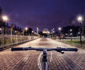 Wall Mural - bicycle handlebar on the background of the road